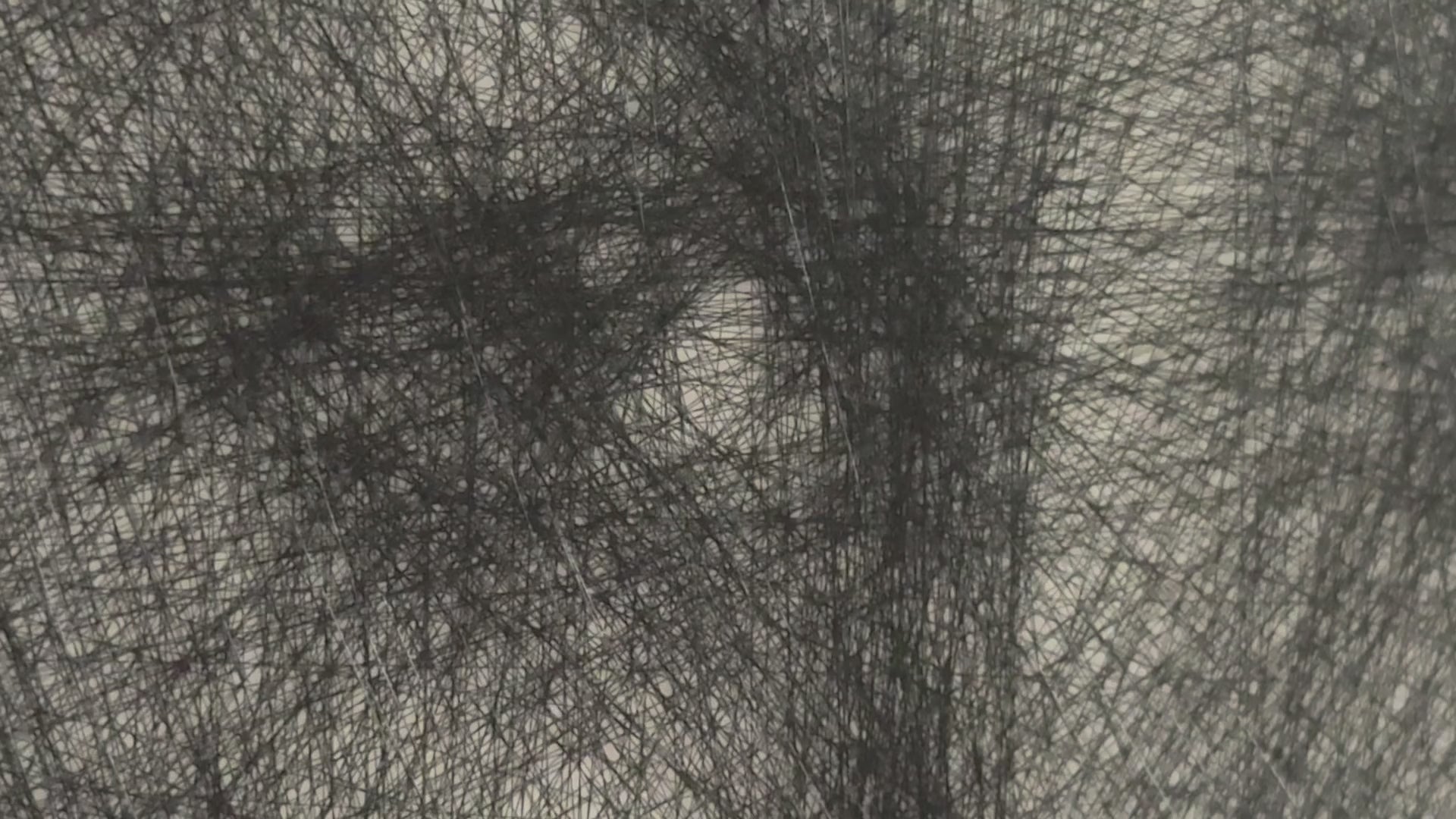 Load video: Video of string art on a wall